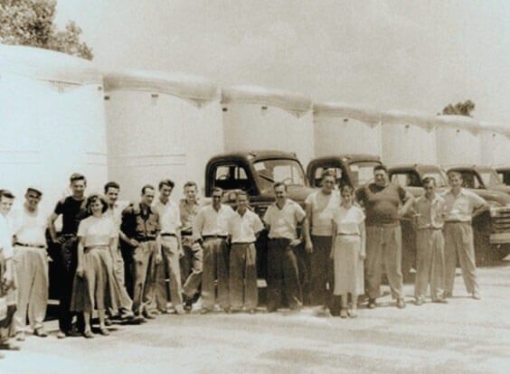 The Sodrel team lined up in front of the fleet in 1953