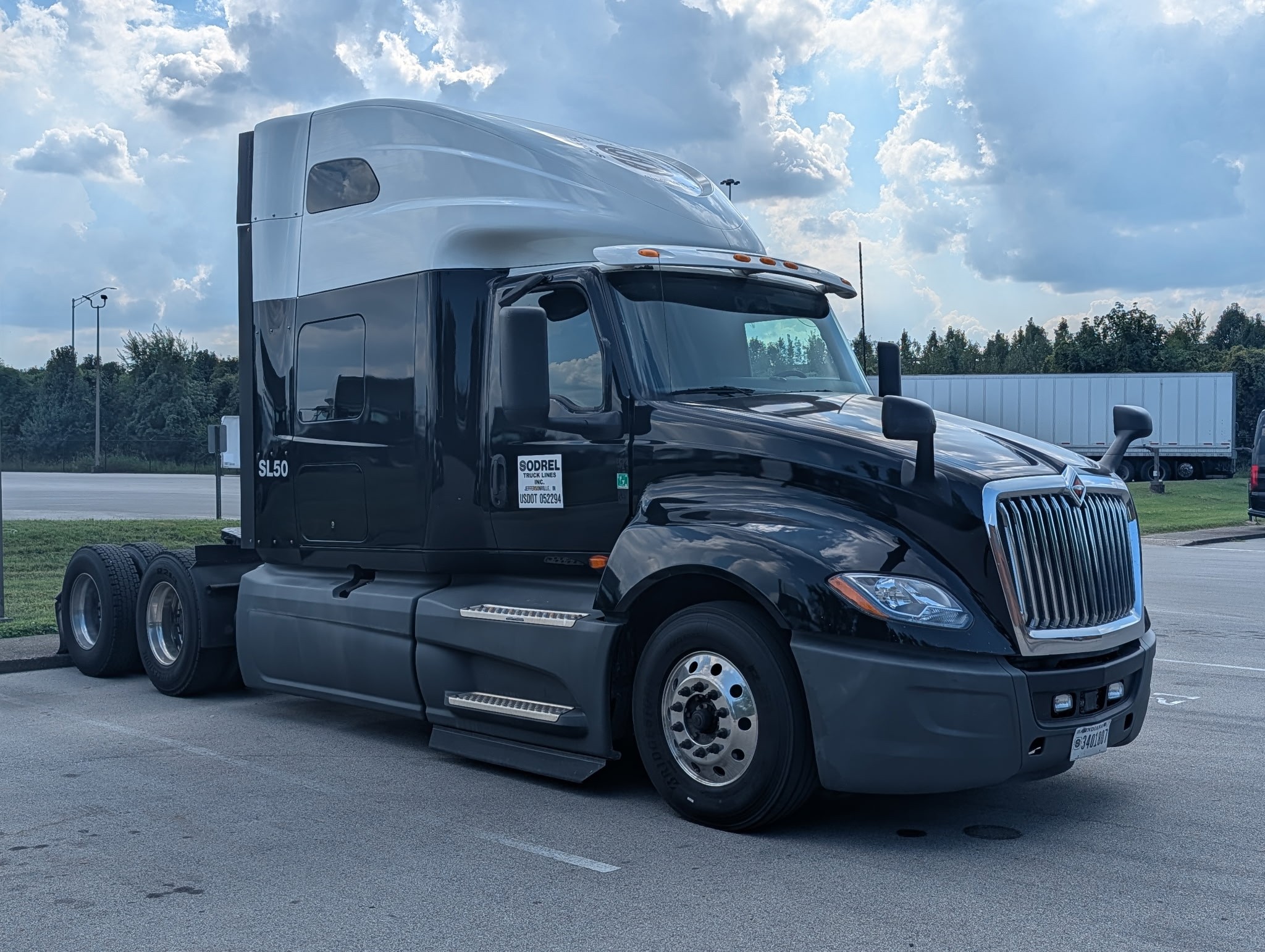 Sleeper cab tractor parked in lot
