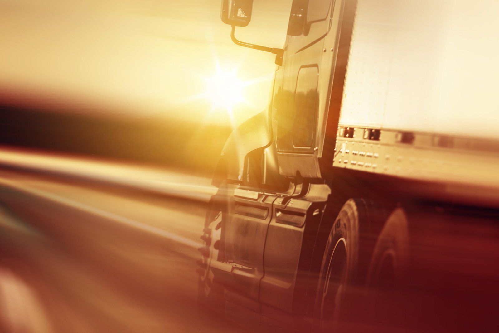 A Sodrel tractor-trailer at sunset